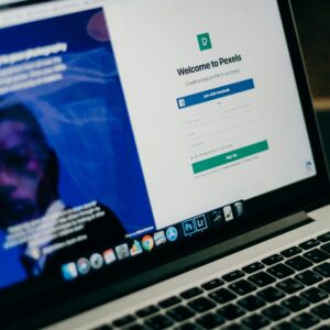 Close-up view of a laptop displaying a sign-up page for an online platform.